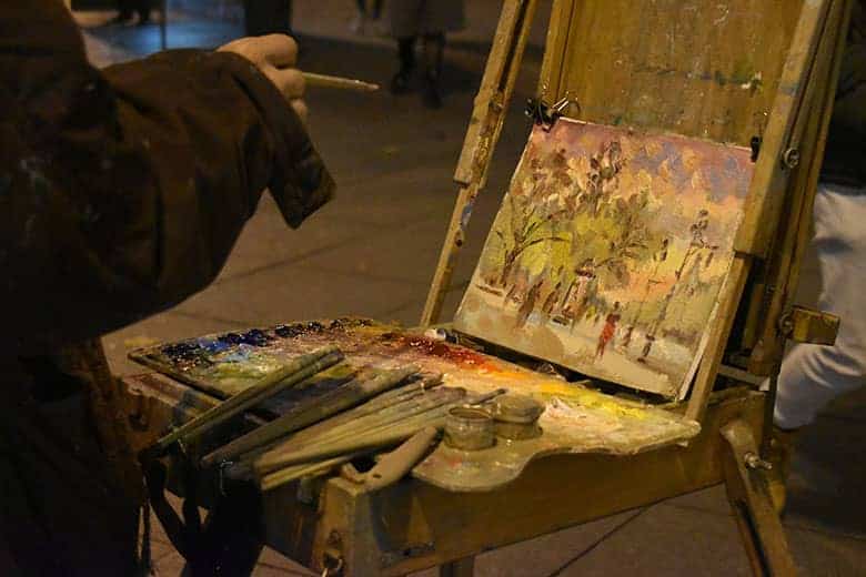 Artist developing their art skills by practicing on an easel